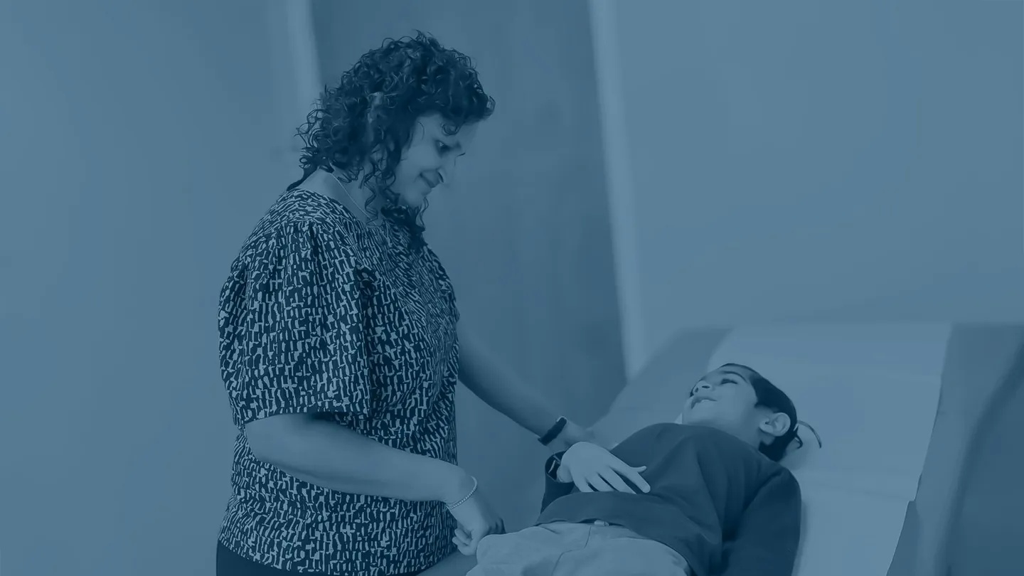 Family doctor caring for a child during an exam at JioMed Family Care in Leawood, KS