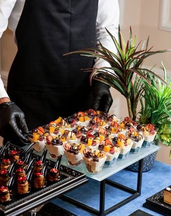 Catering table set with warming trays of Hyderabad House dishes