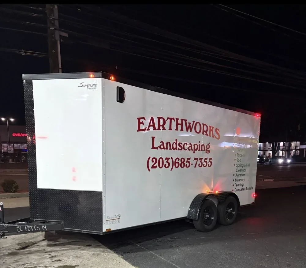 Earthworks Landscaping enclosed work trailer loaded up after a job