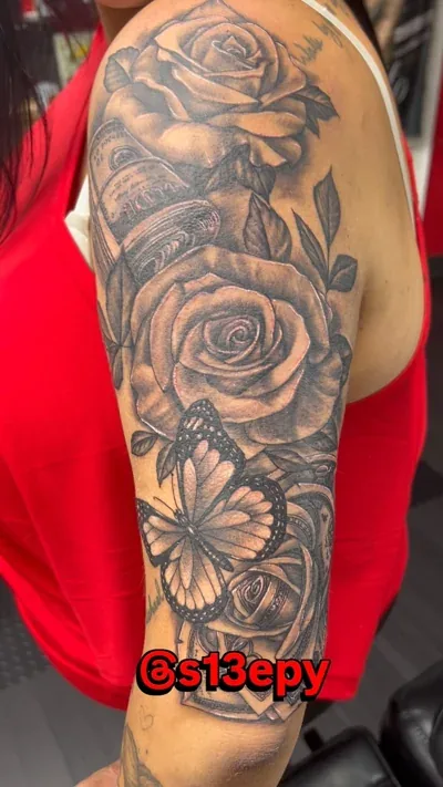 Tattoo of money roses with a butterfly