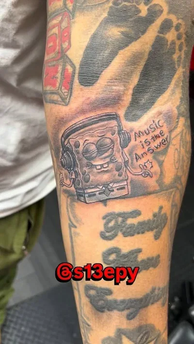 Black and grey filler tattoo work tying a sleeve together